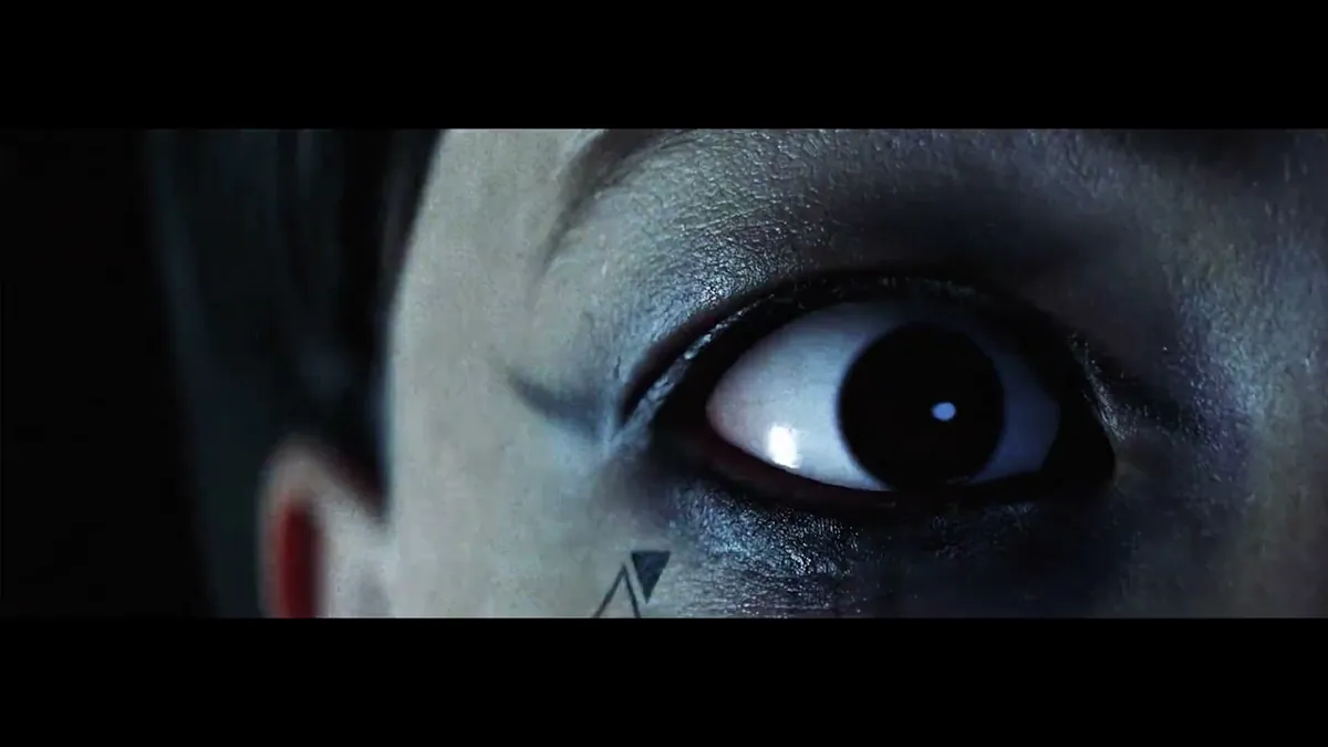 Close-up of a wide eye lit in blue light from the Hellraiser: Revival launch trailer